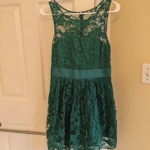 Green lace overlay cocktail dress